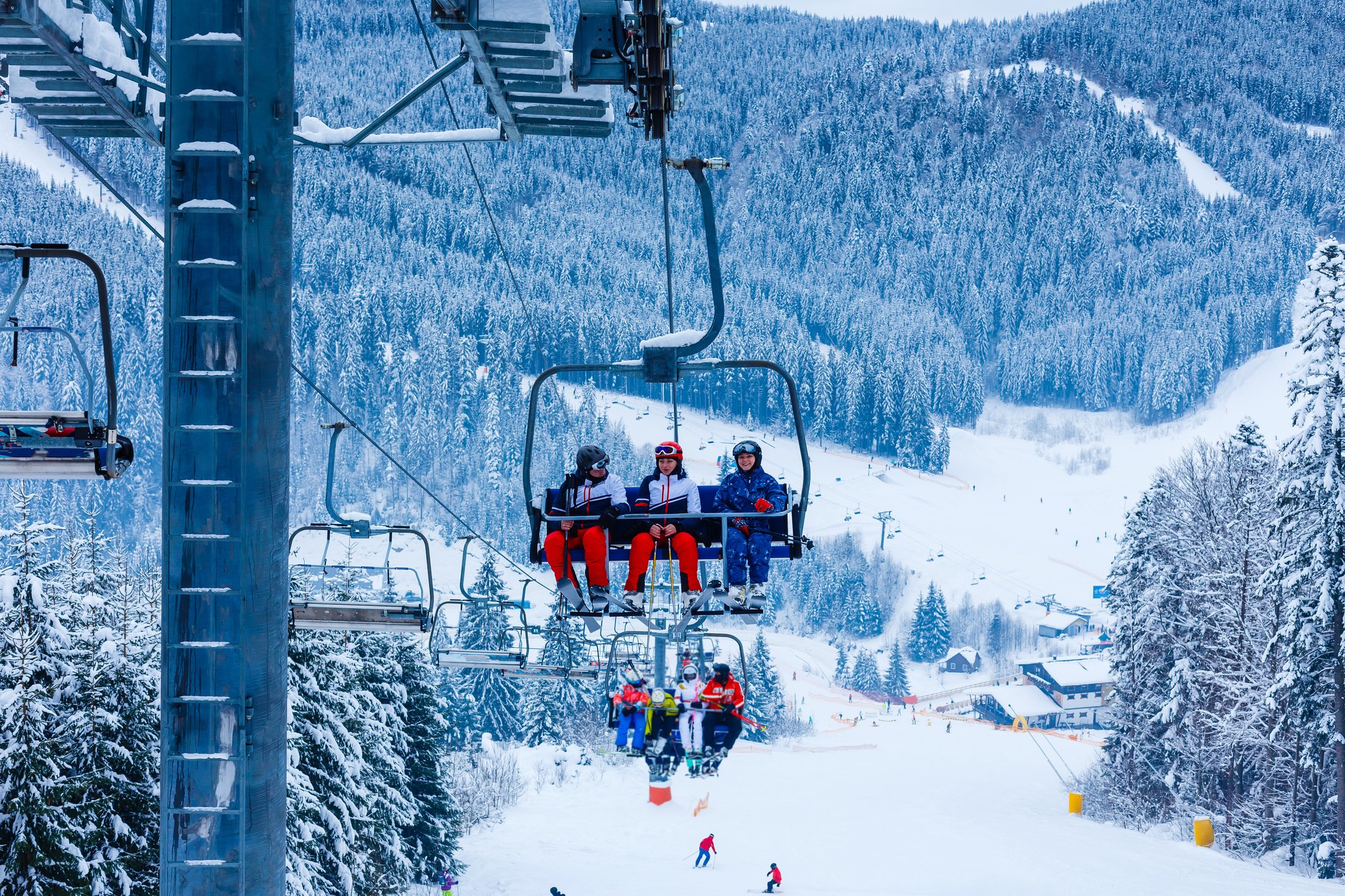 Skiing, ski lift - skiers on ski vacation